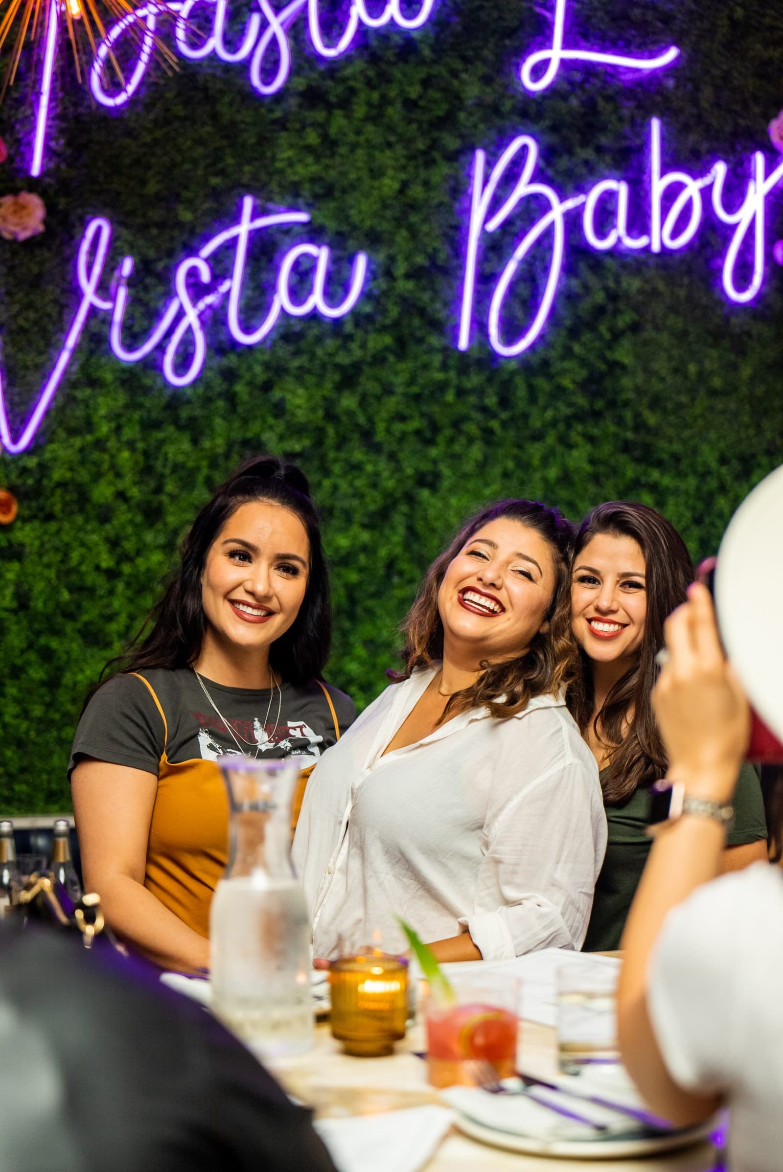 Guests under the neon Pasta La Vista, Baby wall